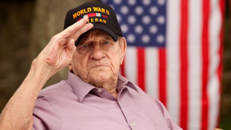 World War II Veteran Saluting with Flag in the Background