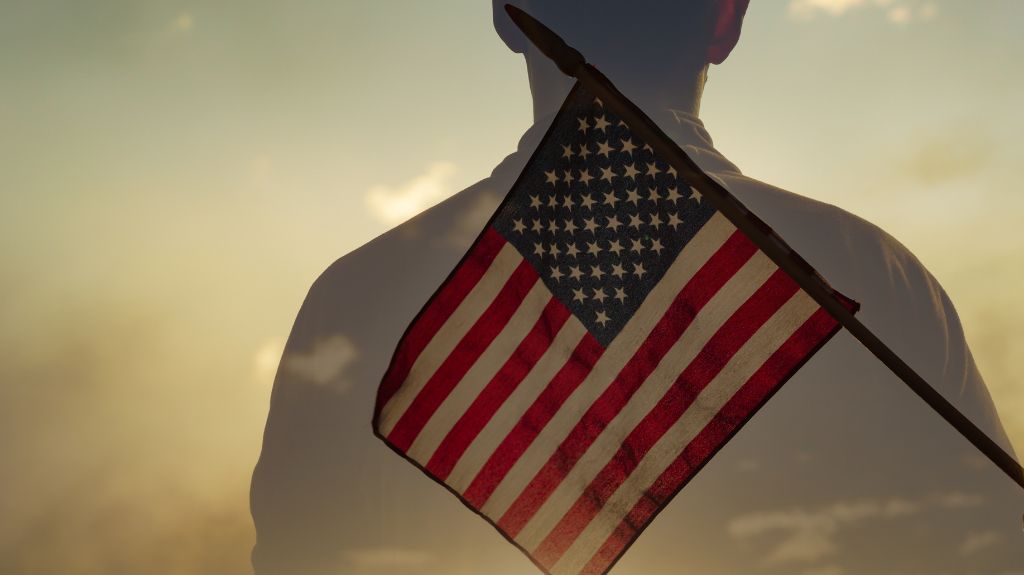 Silhouette of a Veteran with an American Flag in Front