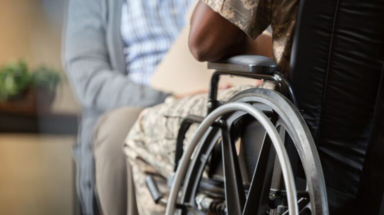 Veteran Sitting in a Doctor's Office in a Wheelchair
