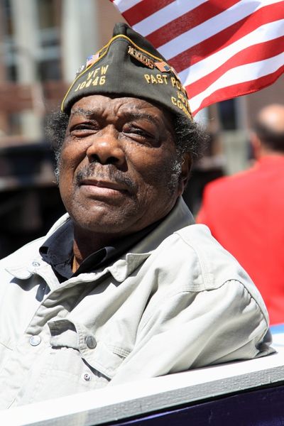 Veteran with American Flag in the Background