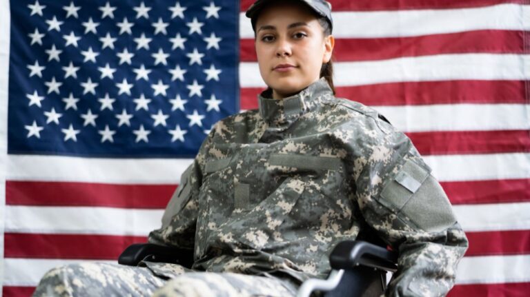 Soldier in a Wheelchair in Front of an American Flag