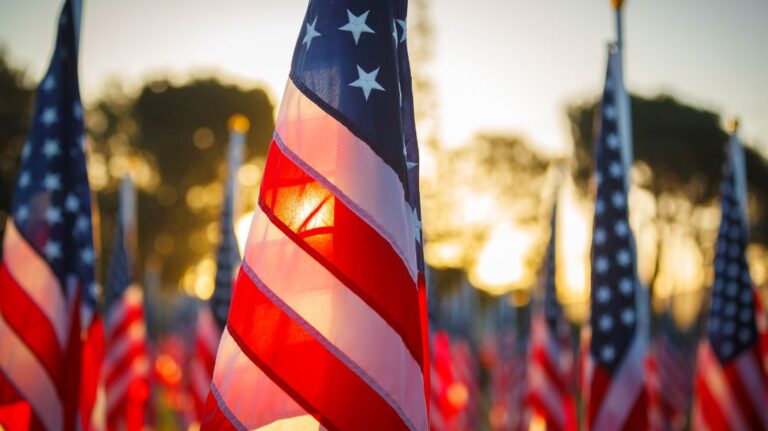 Close Up of American Flags at Sunset