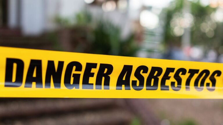 Yellow Caution Tape with Danger Asbestos on it