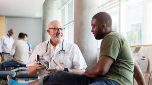 Doctor Speaking with Veteran in Hospital
