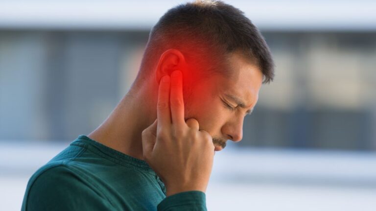 Man Holding Ear with Red Pain Indication