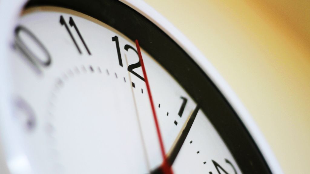 Close Up of Hands on a Clock