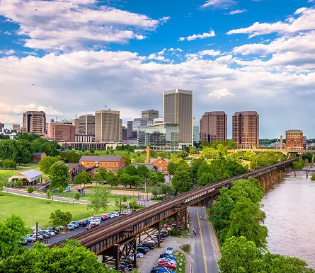 A bridge spans a river in Richmond, showcasing the scenic landscape and urban architecture
