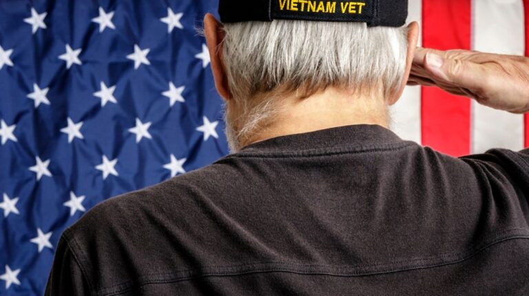 Vietnam Veteran Saluting American Flag