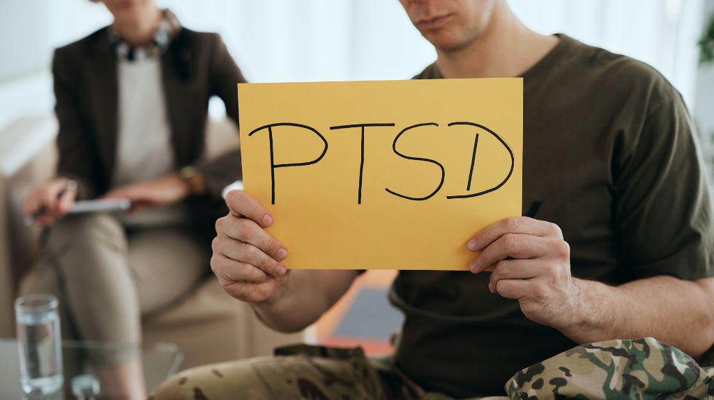 Veteran in Group with PTSD Sign
