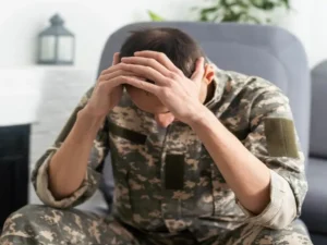 Soldier Holding Head in hands