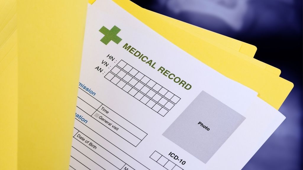 Medical Report Documents in Yellow File Folder