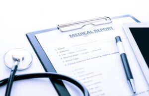 Medical Report Documents on a Clipboard with Pen and Stethoscope