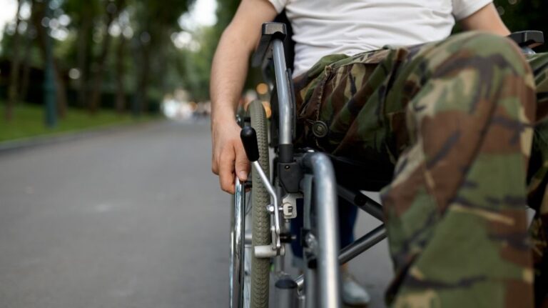 Close Up of Veteran in Camouflage in Wheelchair