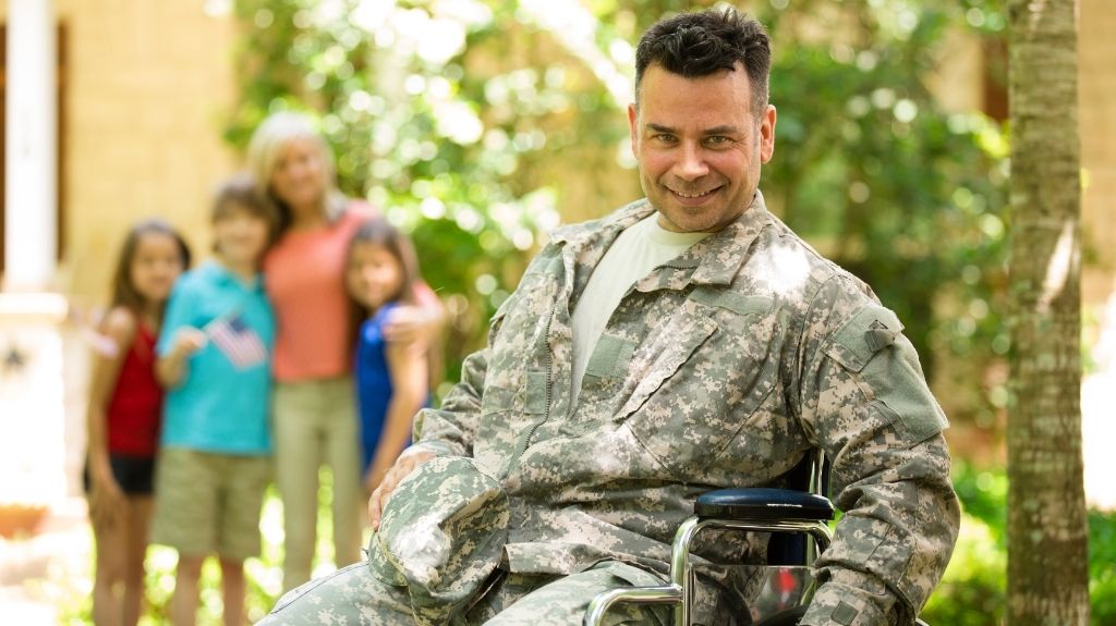 Veteran in Wheelchair with Family in the Background