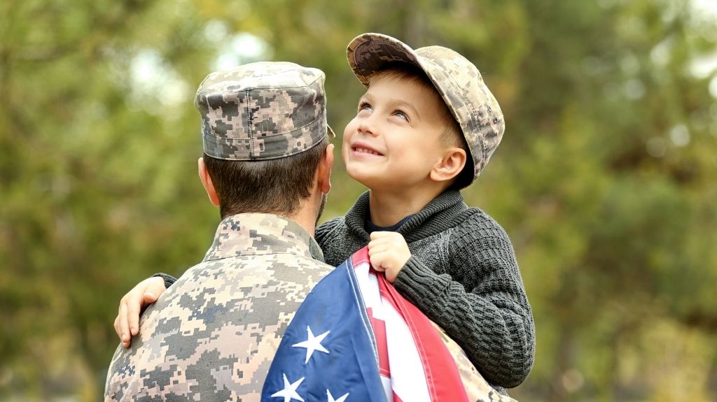 Soldier Holding Child and Flag