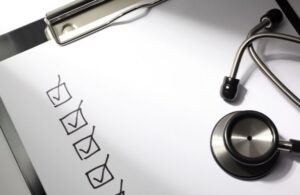 Document on Clipboard with Checked Boxes and Stethoscope